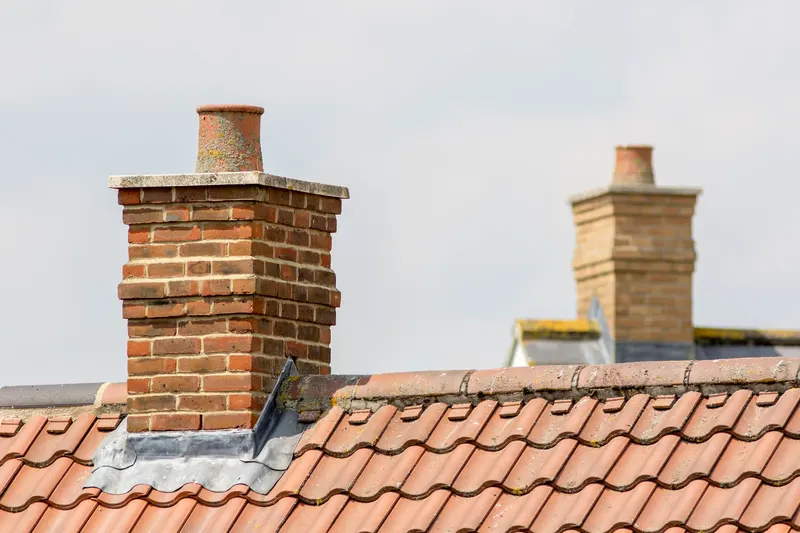 Brick chimneys and lead flashing